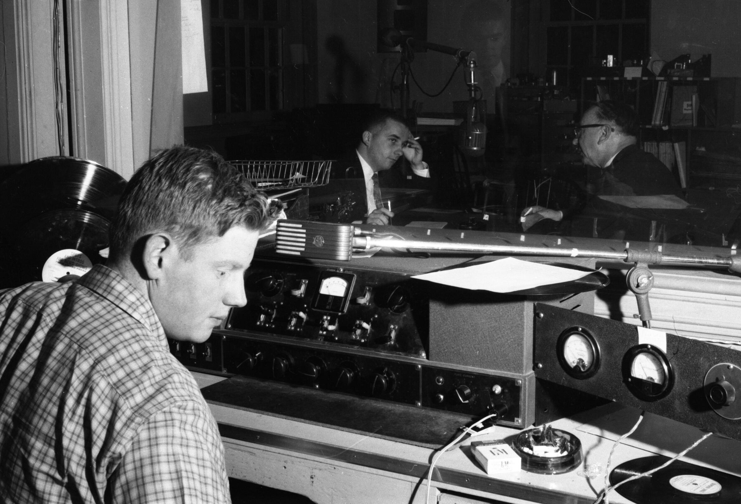 Student running a radio audio console.