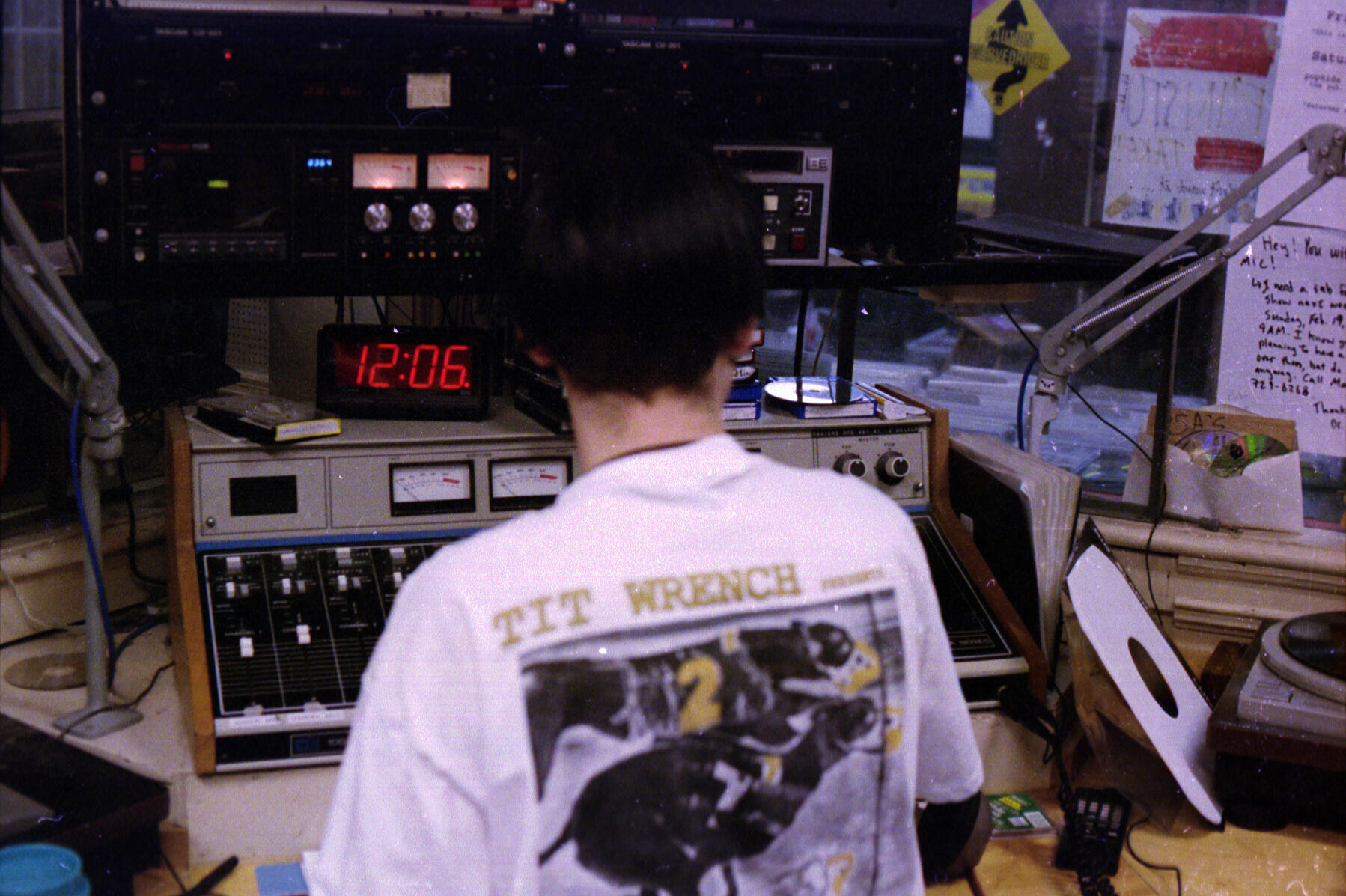 A student sits at a microphone